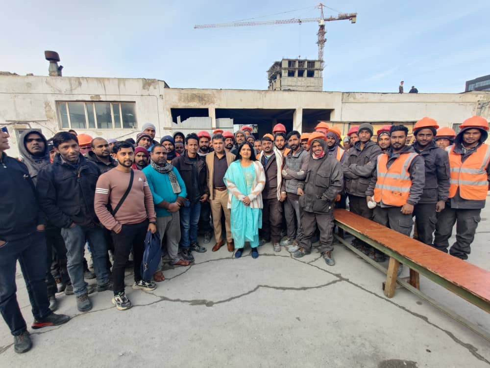 Client visit — crew gathered with project leadership