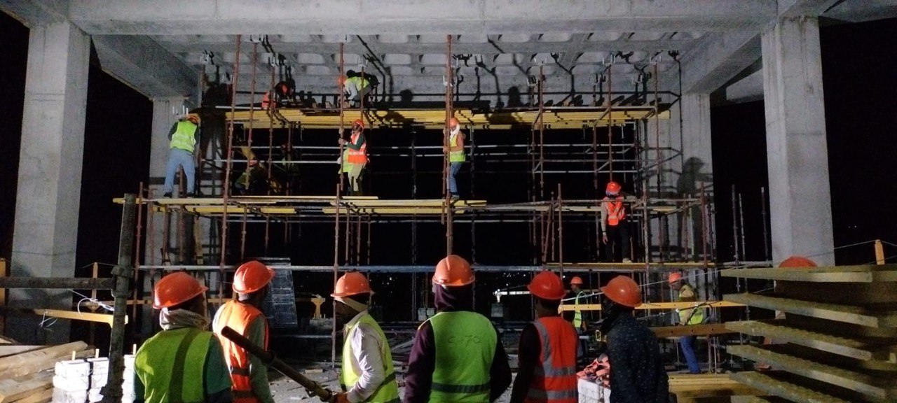 Night shift — formwork and rebar in progress